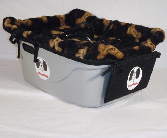 FidoRido tan two-seater with light-weight fleece in red with black paw prints and a small harness an dog kennel