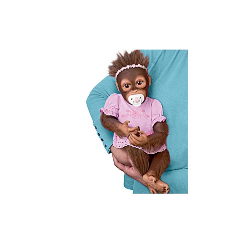 The Ashton-Drake Galleries The Ashton - Drake Galleries Cooing Cora "Coos" and “Breathes” So Truly Real® Lifelike Weighted Monkey Doll 18"