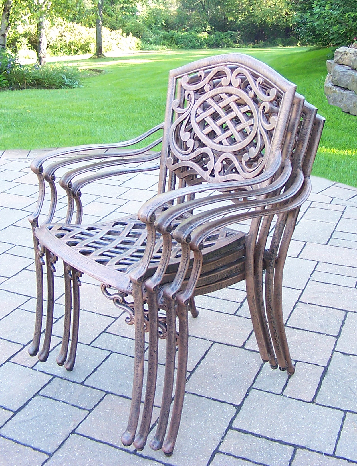 Oakland Living 7 Pc. Patio Dining set with 54" Stone topped table and Cast Aluminum Stackable Chairs