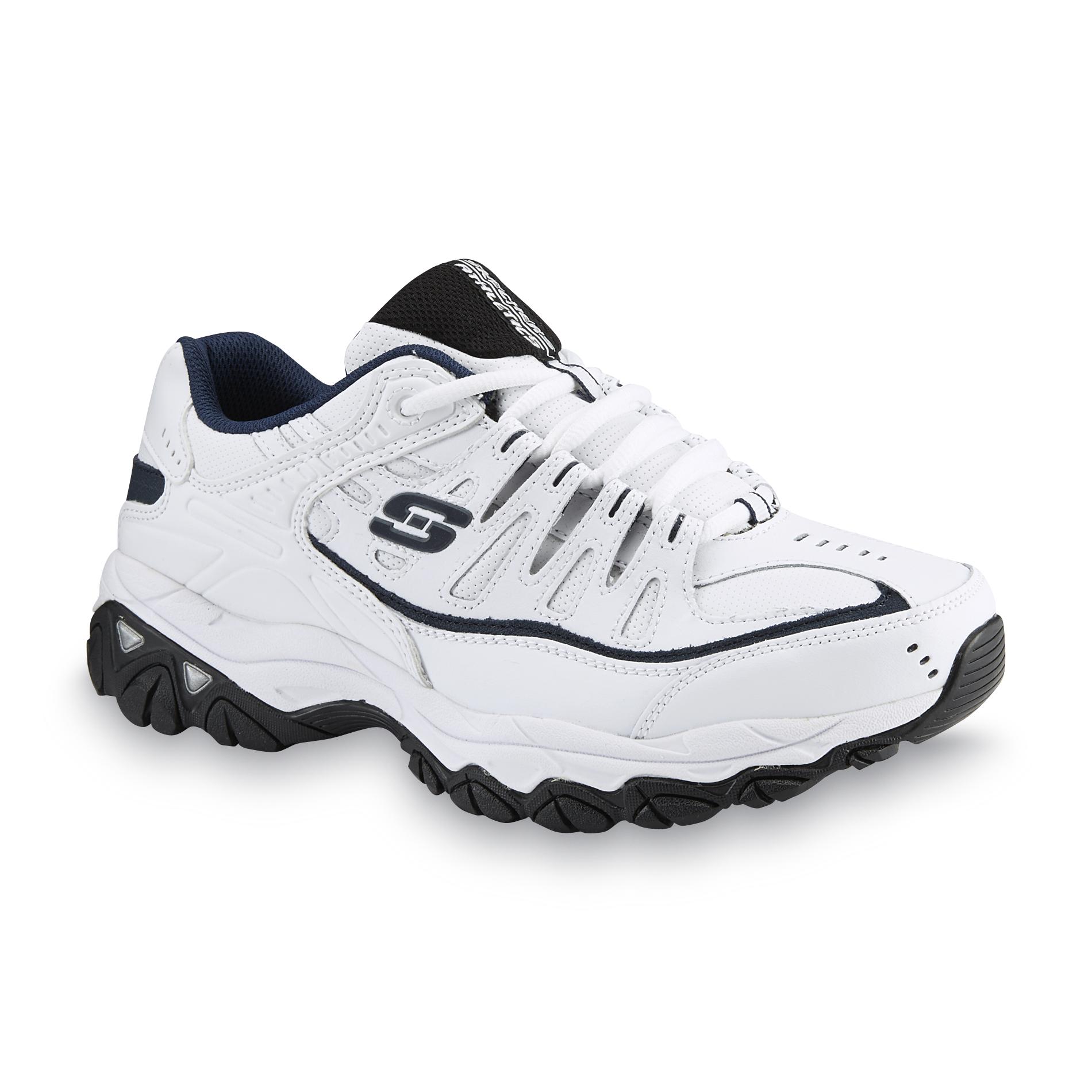white sketcher tennis shoes