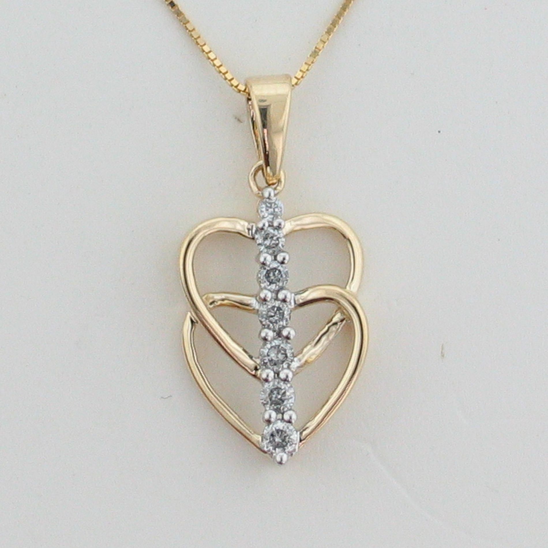 1/4 cttw Diamond Heart Pendant. 10kt Yellow Gold