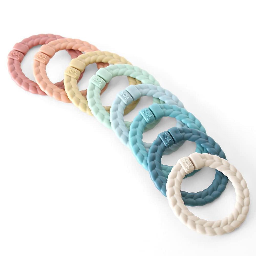 itzy ritzy linking ring set; set of 8 braided, rainbow-colored versatile linking rings; attach to car seats, strollers & acti