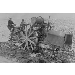 Buyenlarge Buy Enlarge 0-587-46065-LP12x18 German Designed Huge Tractor digs for unearths potatoes.- Paper Size P12x18