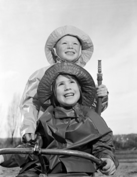 BrainBoosters Brother & Sister Wearing Rain Coats & Holding Garden Hose Poster Print - 18 x 24 in.