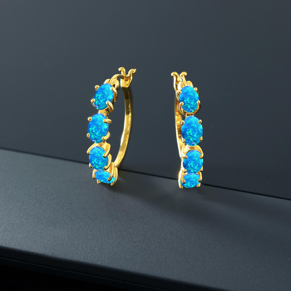 Gem Stone King 18K Yellow Gold Plated Silver Blue Simulated Opal Hoop Earrings For Women (4.00 Cttw, Oval Cabochon 6X4MM)