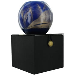 COBALT CANDLE GLOBE THE INSIDE OF THIS 4 in POLISHED GLOBE IS PAINTED WITH WAX TO CREATE SWIRLS OF GOLD AND RICH HUES AND COMES IN A SATIN COVERED G