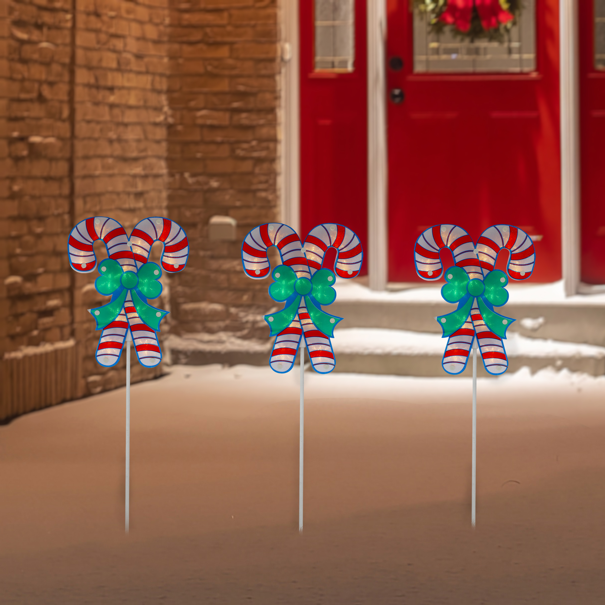 Northlight Set of 3 Lighted Holographic Candy Cane Christmas Pathway Markers 25.5"